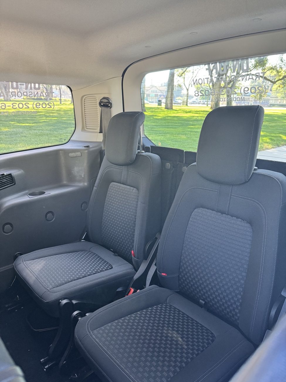 Two rear passenger seats inside the transportation van